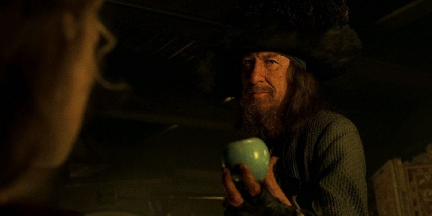 Barbossa holding out an apple in Pirates of the Caribbean