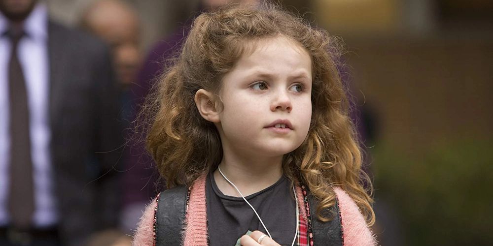 Chloe wears a backpack on the street in Big Little Lies