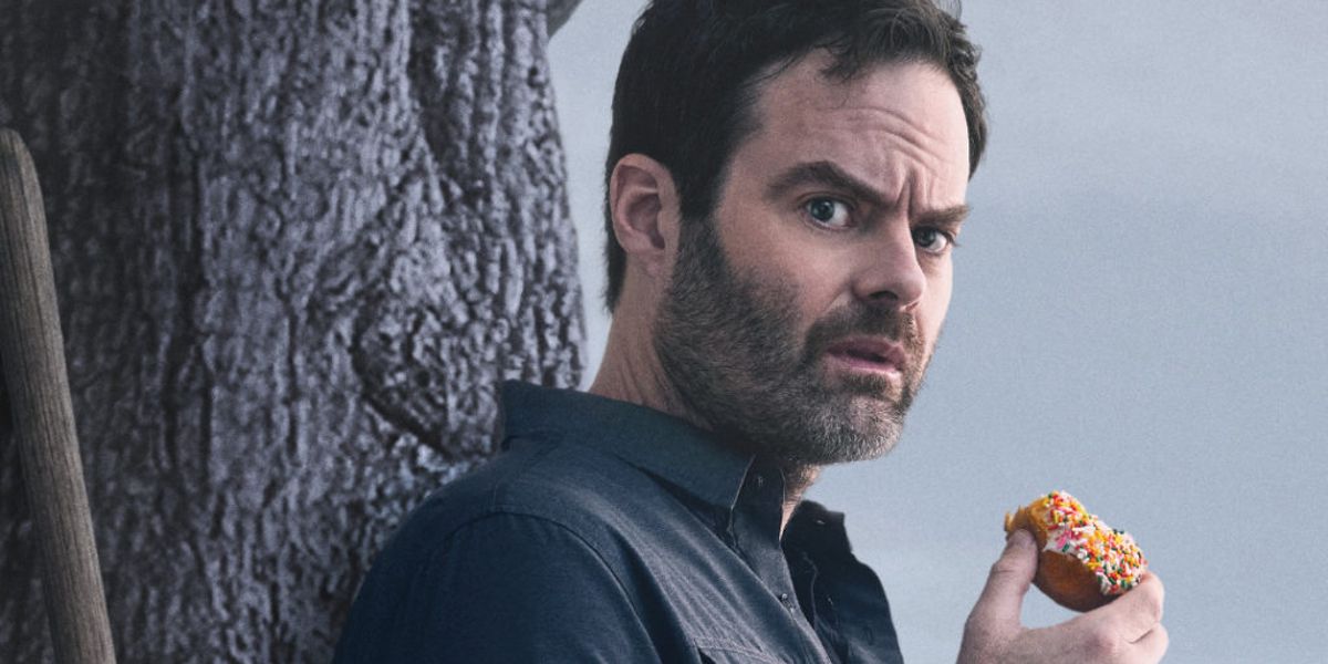 Barry (Bill Hader) eating a donut and looking confused in HBO's Barry