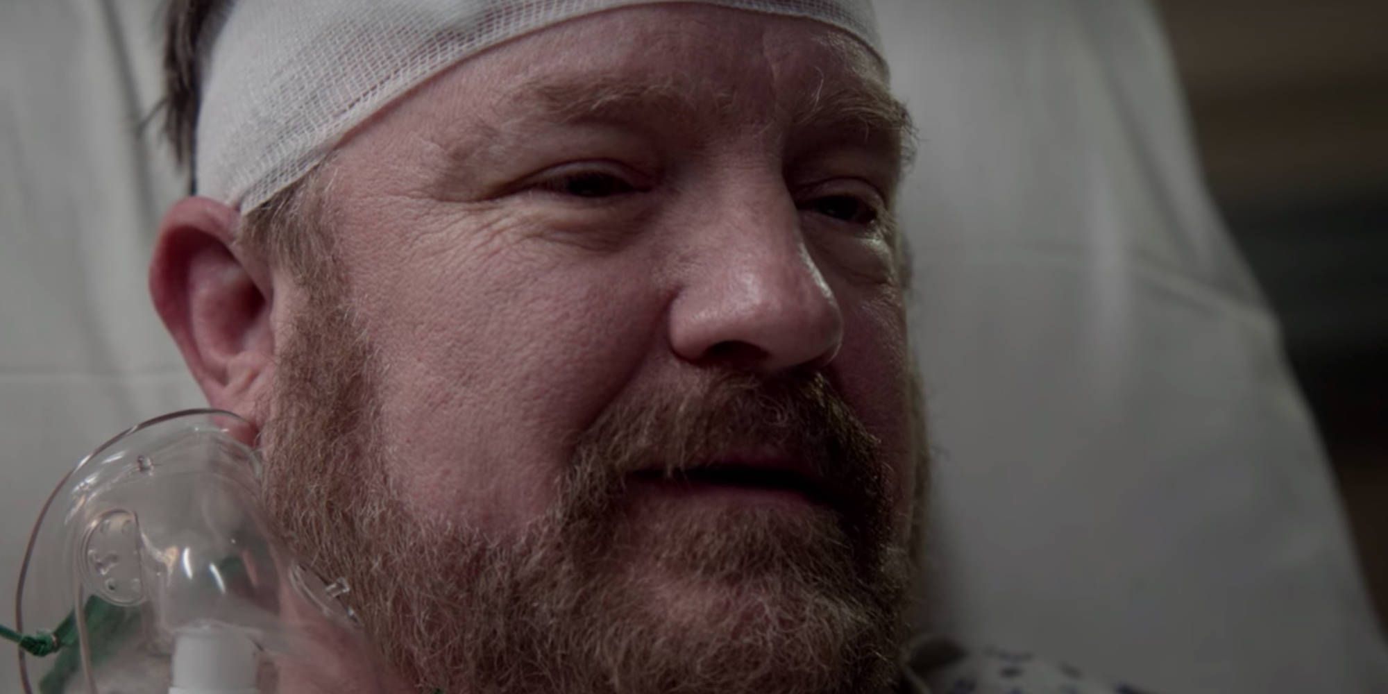 Bobby Singer in a hospital bed during his death scene in Supernatural.