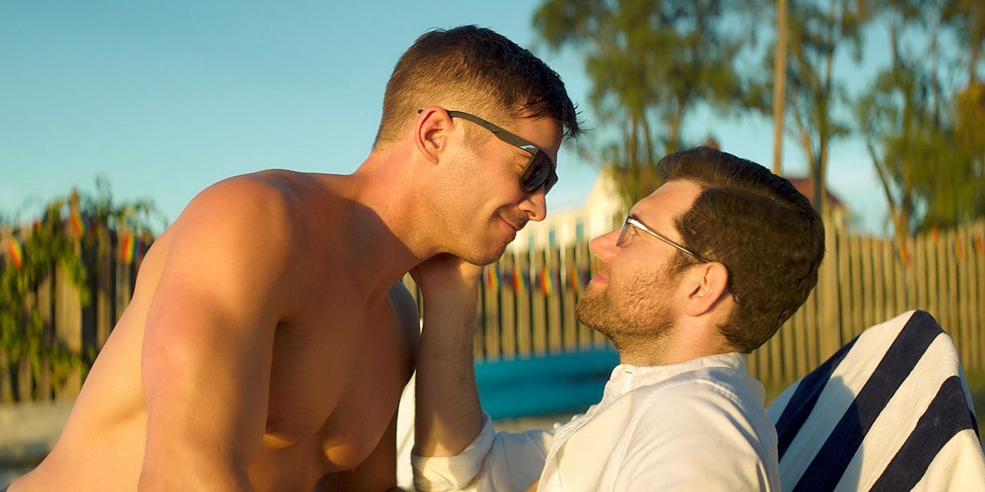 Bobby and Aaron about to kiss by the pool in Bros.