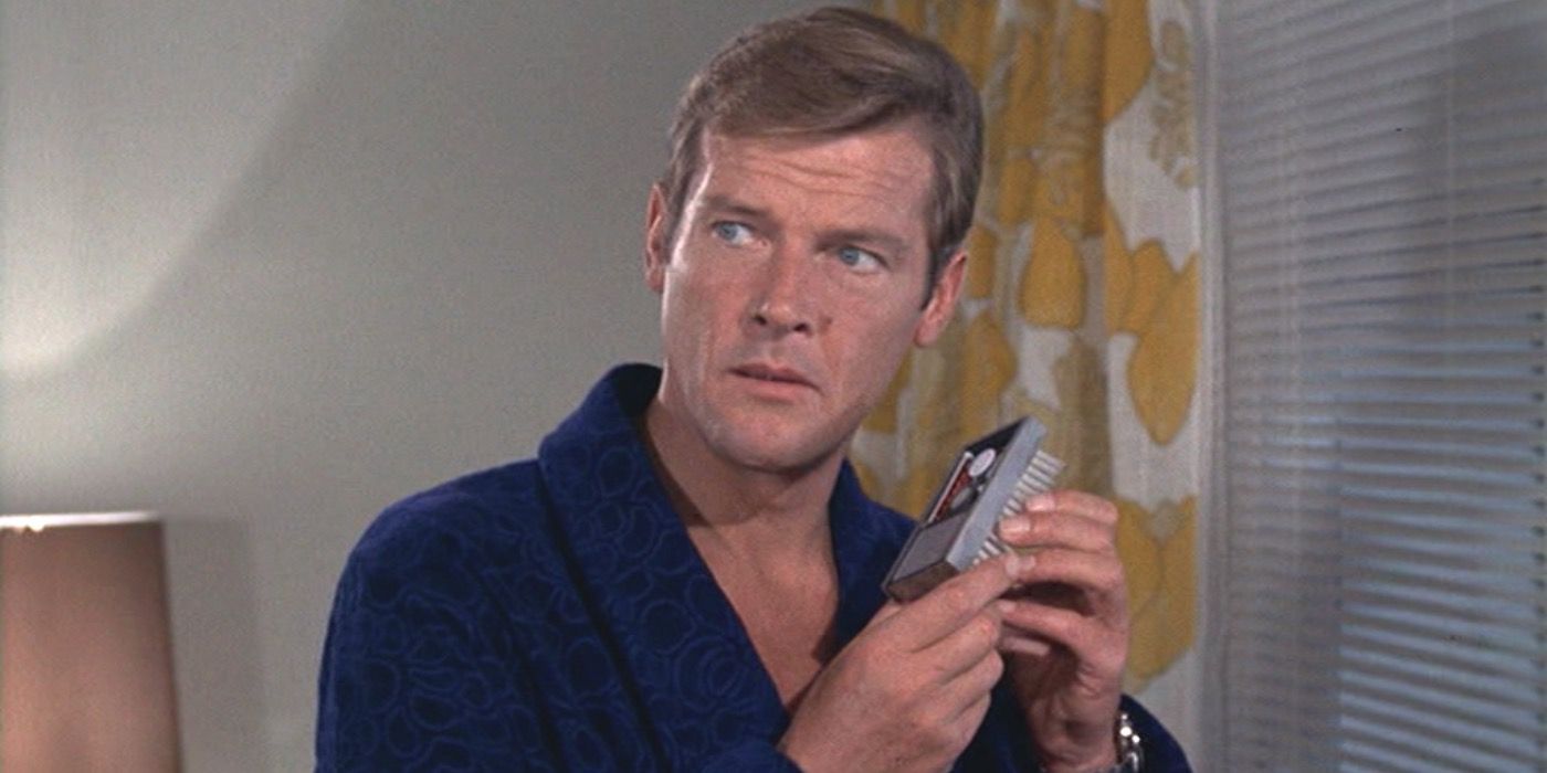 Roger Moore holding the bug detector gadget in Live and Let Die