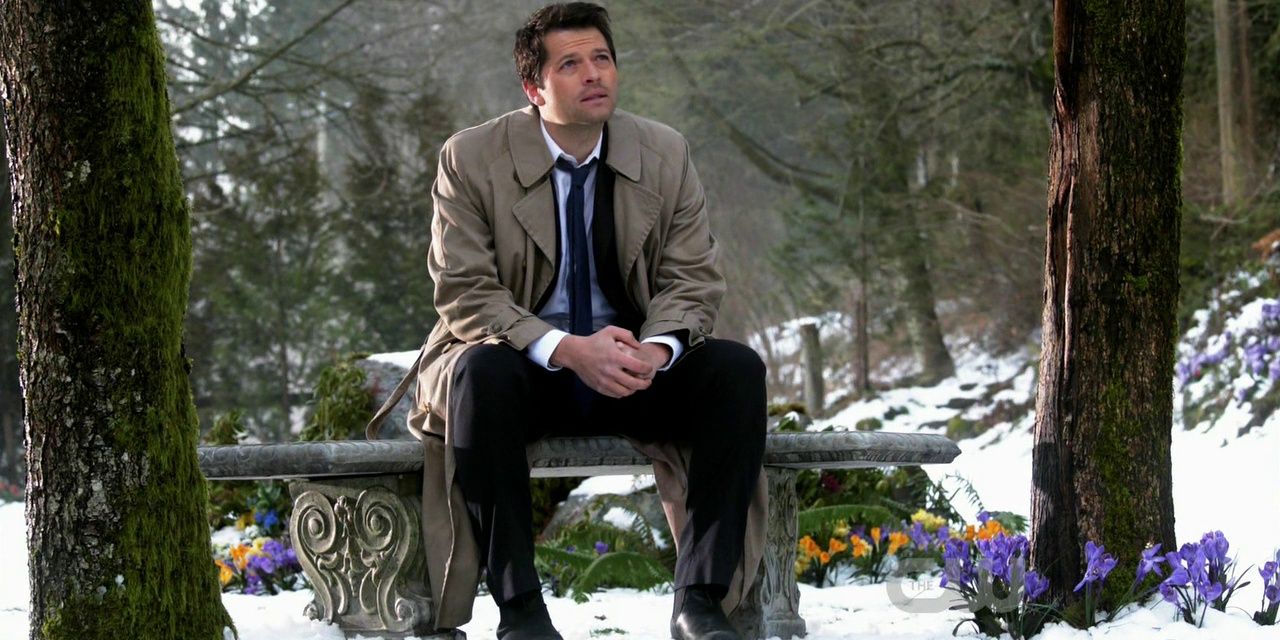 Castiel sitting on a bench and looking up in Supernatural 
