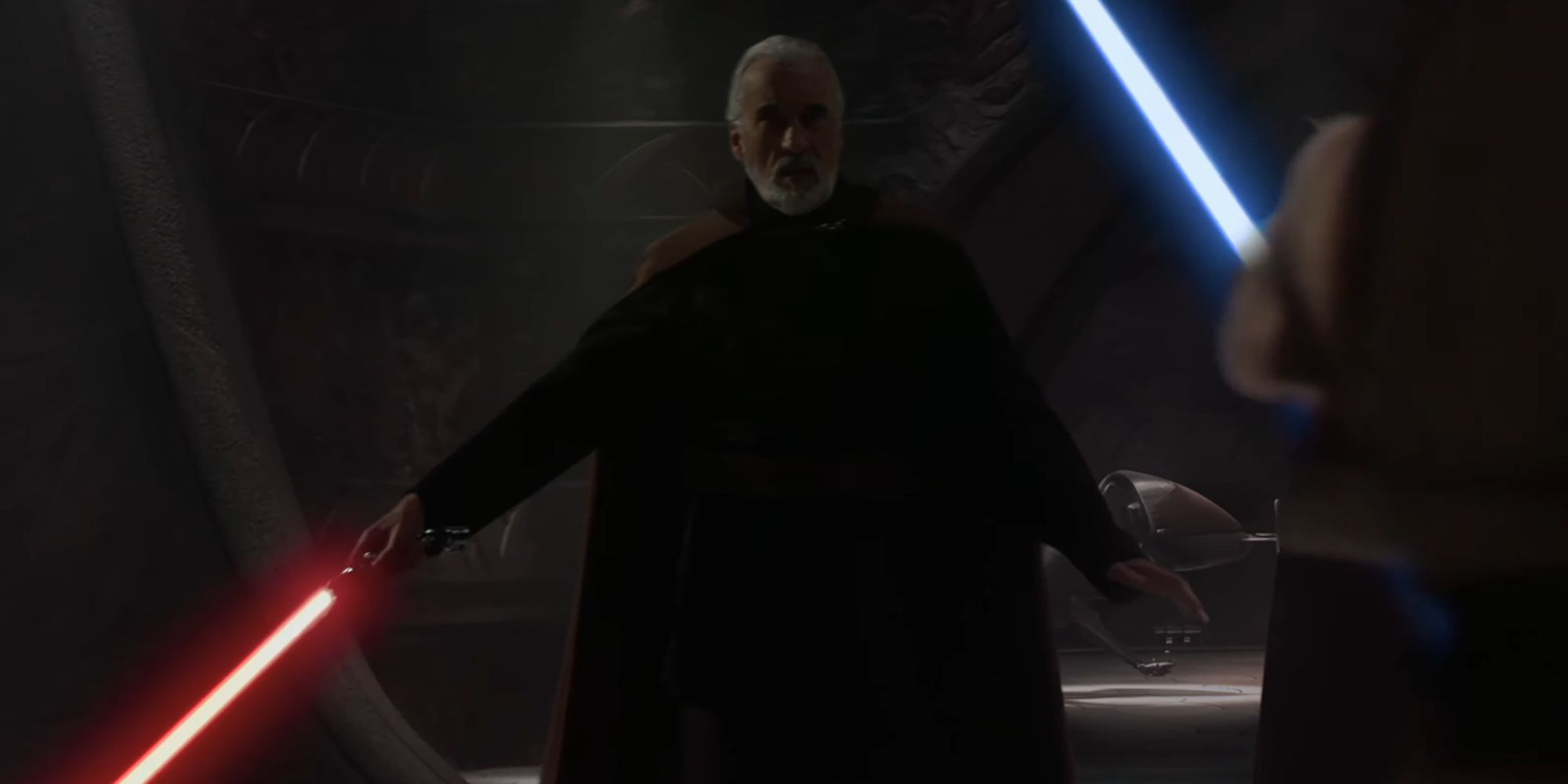 Count Dooku igniting his lightsaber before Obi-Wan Kenobi in Attack Of The Clones