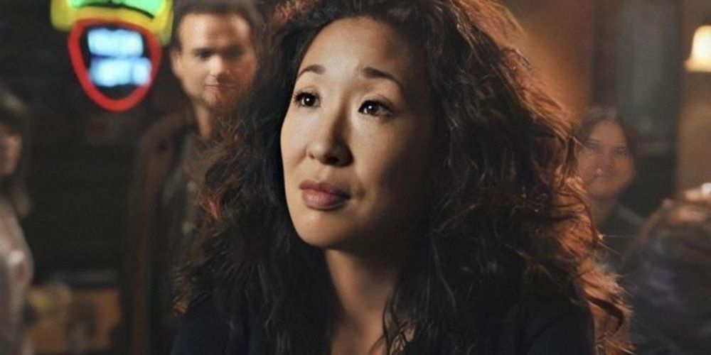 Cristina Yang sitting at a bar in Grey&rsquo;s Anatomy