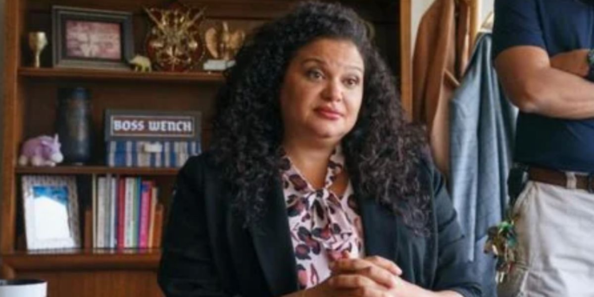 Principal Collins looking annoyed in her office in Hulu&rsquo;s Crush