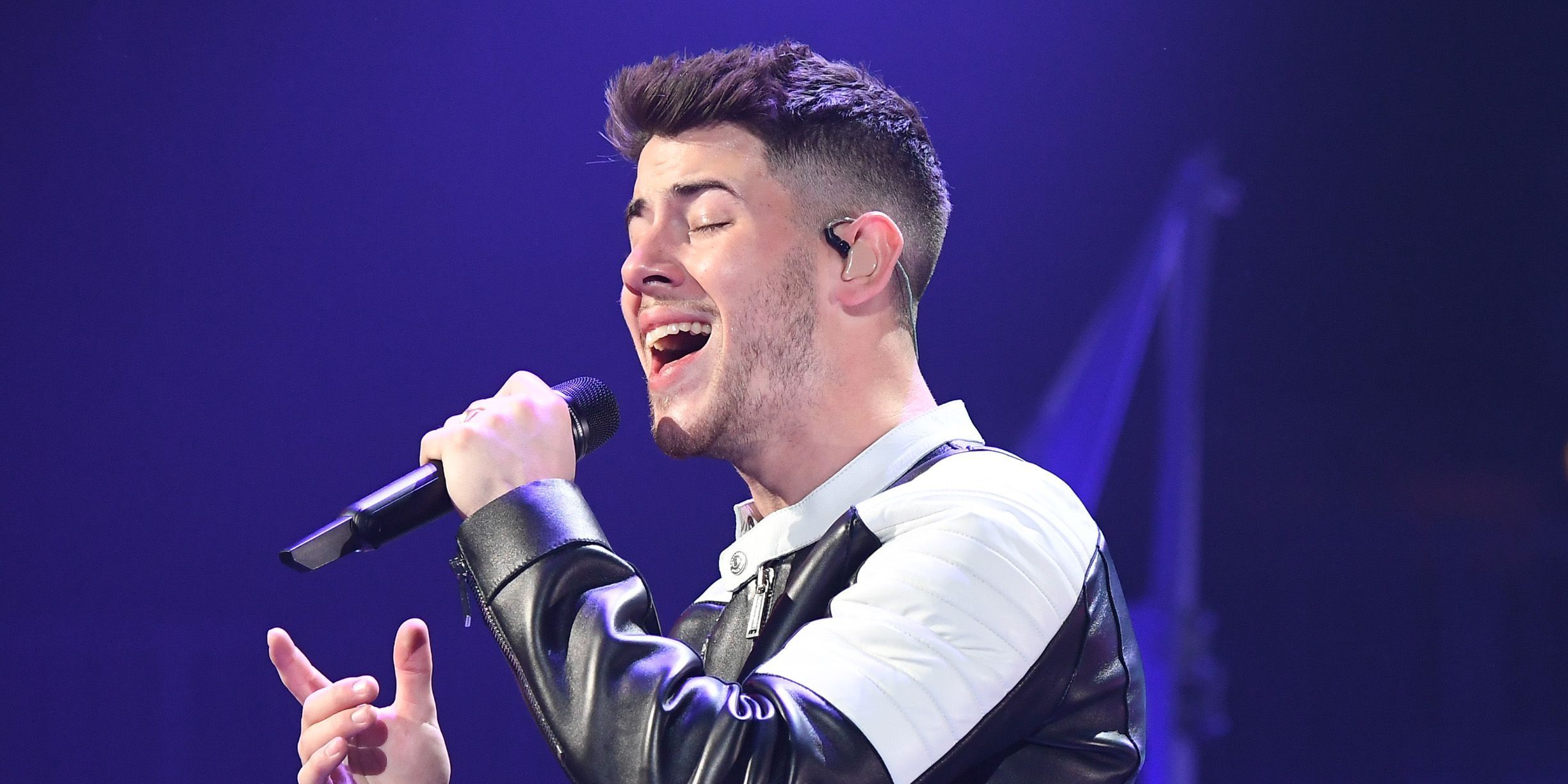 Nick Jonas performing onstage