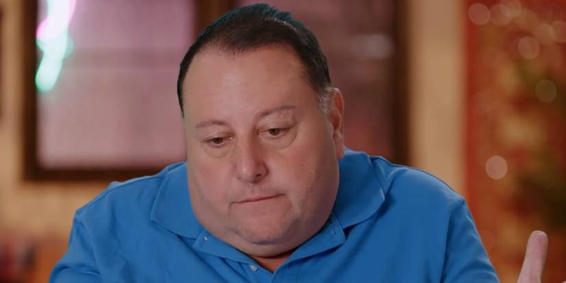 David Toborowsky from 90 Day Fiancé wearing blue shirt shrugging