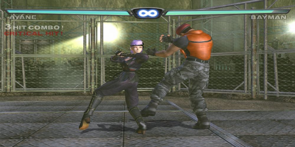 Ayane punches Batman inside a steel cage in DOA 3