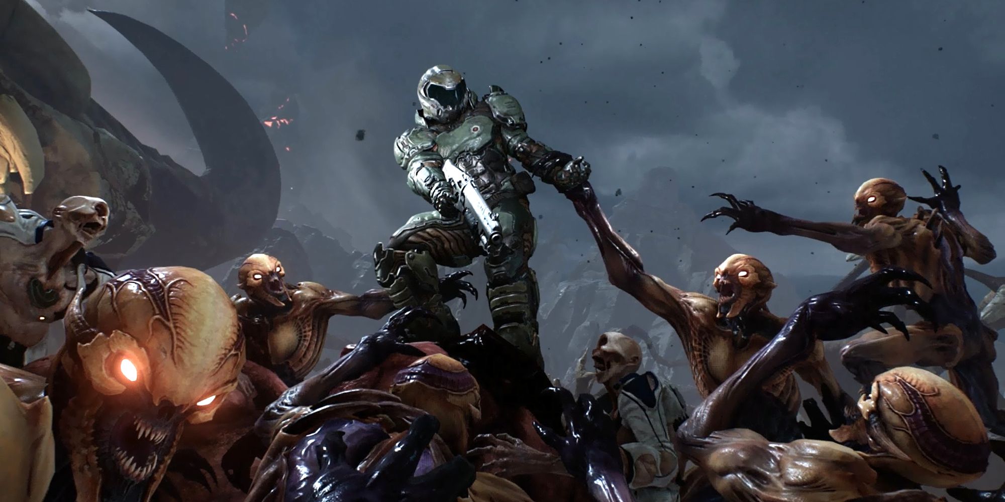 Doomslayer surrounded by imps in Doom 2016