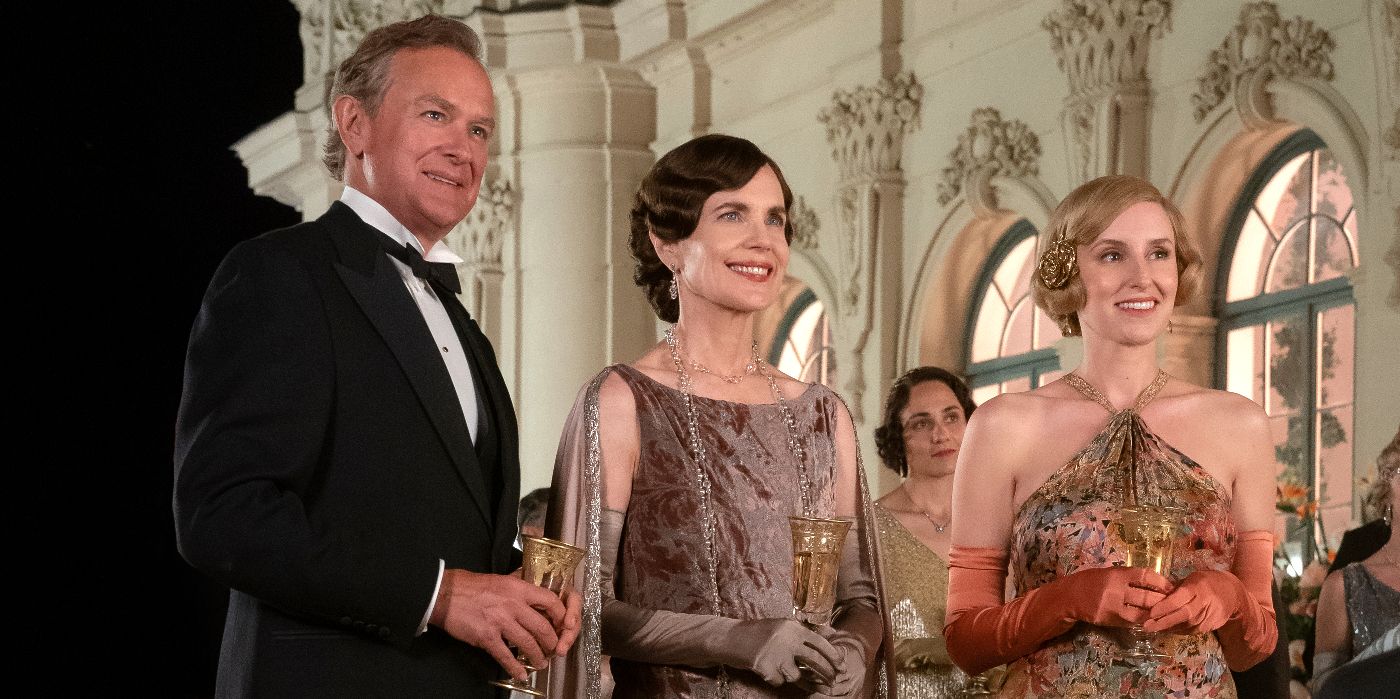 Robert, Cora and Edith stand looking over a balcony in Downton Abbey: A New Era