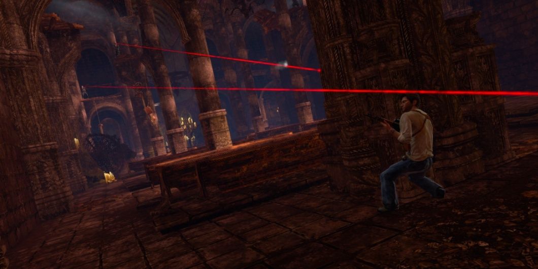 Drake takes cover from lasers in Uncharted 