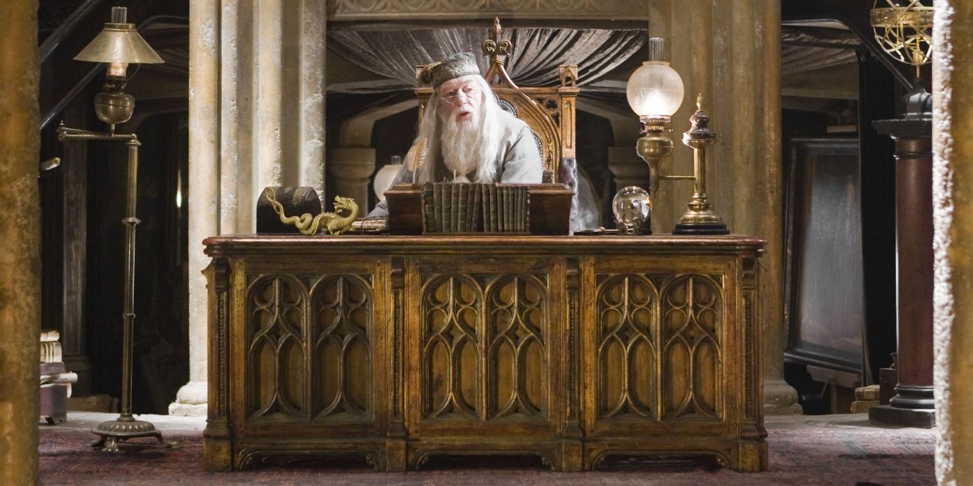 Dumbledore sitting at his desk in Harry Potter