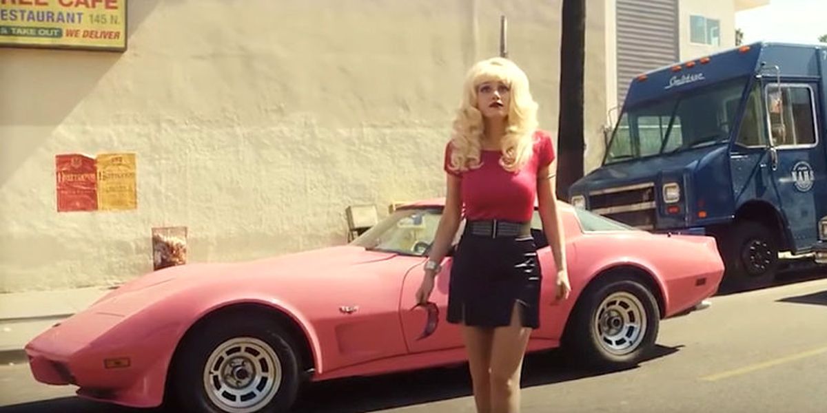Angelyne (Emmy Rossum) and her pink corvette in Angelyne for Peacock 