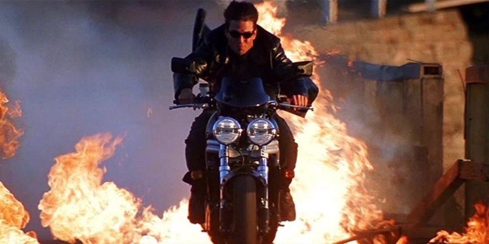 Ethan Hunt riding a bike through fire in Mission Impossible II 