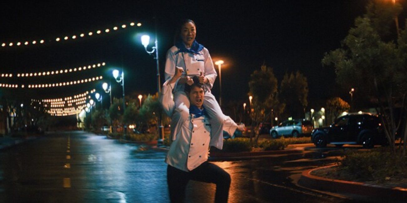 Evelyn rides on Chad's shoulders in Everything Everywhere All at Once