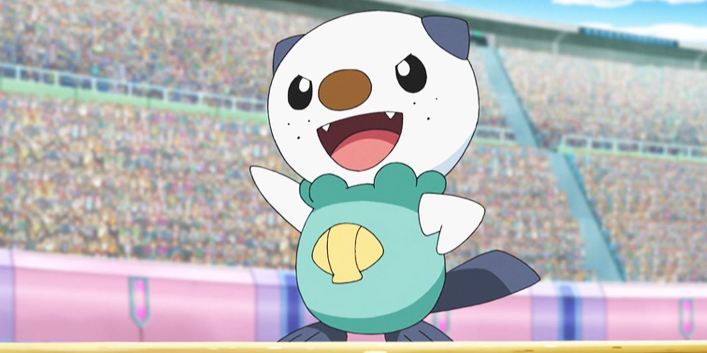 Ash's Oshawott in the Pokémon anime stands in the middle of a stadium and waves.