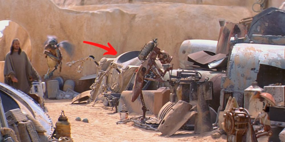 Extravehicluar activity pod or EVA in watto's junkyard while qui-gon jinn and watto pass by