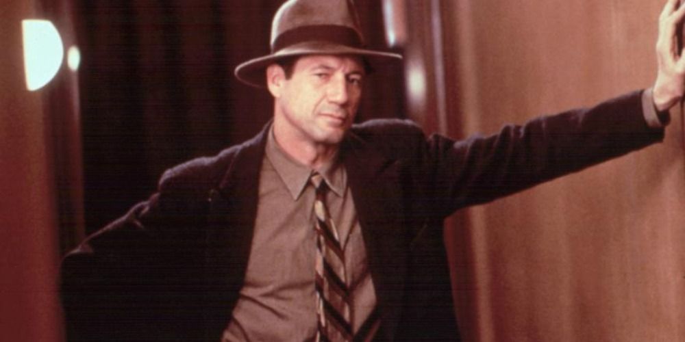 Fred Ward as Detective Lovecraft in Cast a Deadly Spell