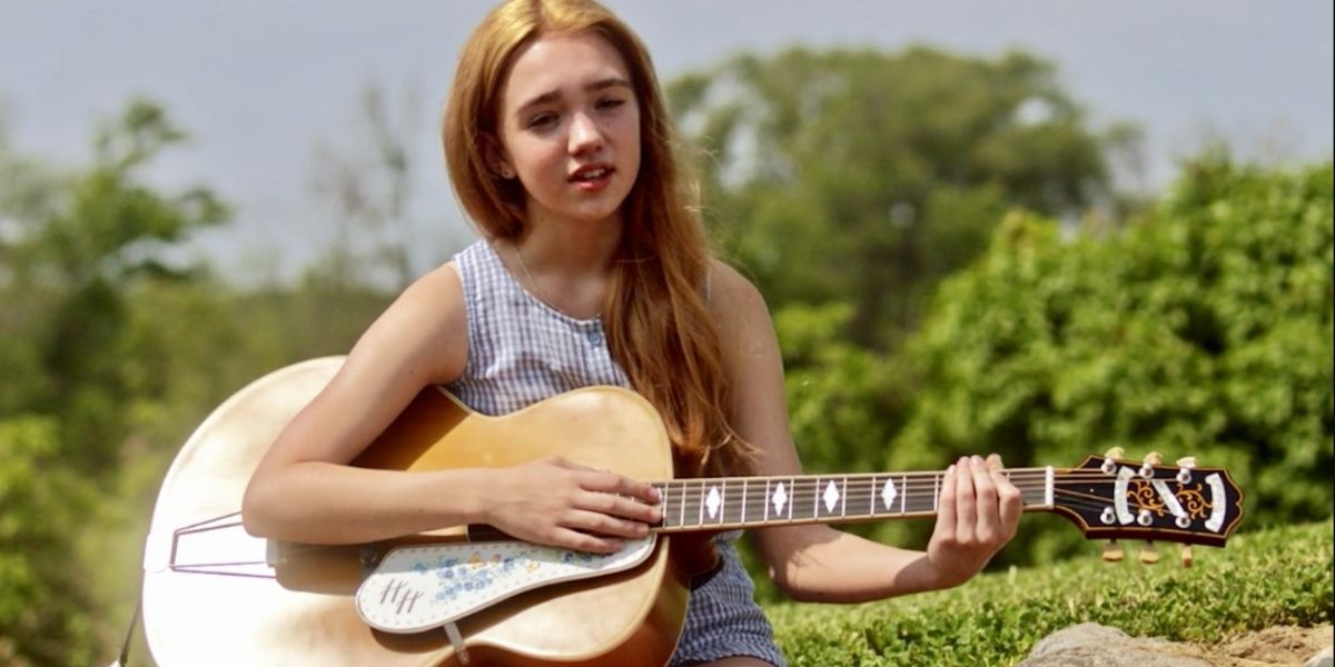 Holly playing guitar in Holly Hobbie (2018-)