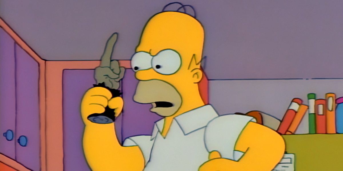 Homer holds a cursed monkeys paw in The Simpsons