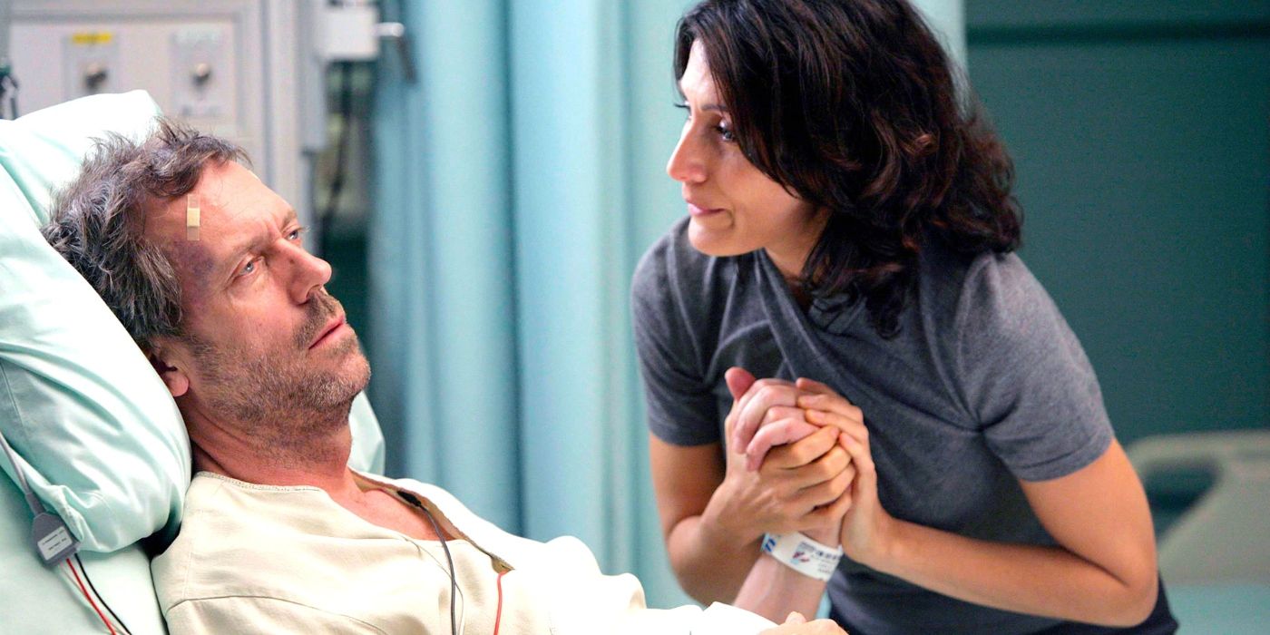 House lying in a hospital bed with Dr. Lisa Cuddy on House