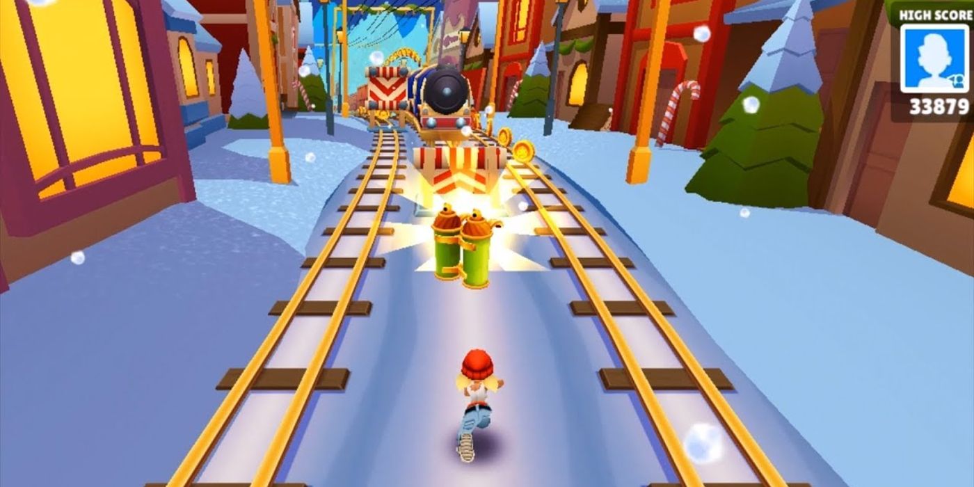 A Subway Surfers player running between two tracks, about to pick up an item.