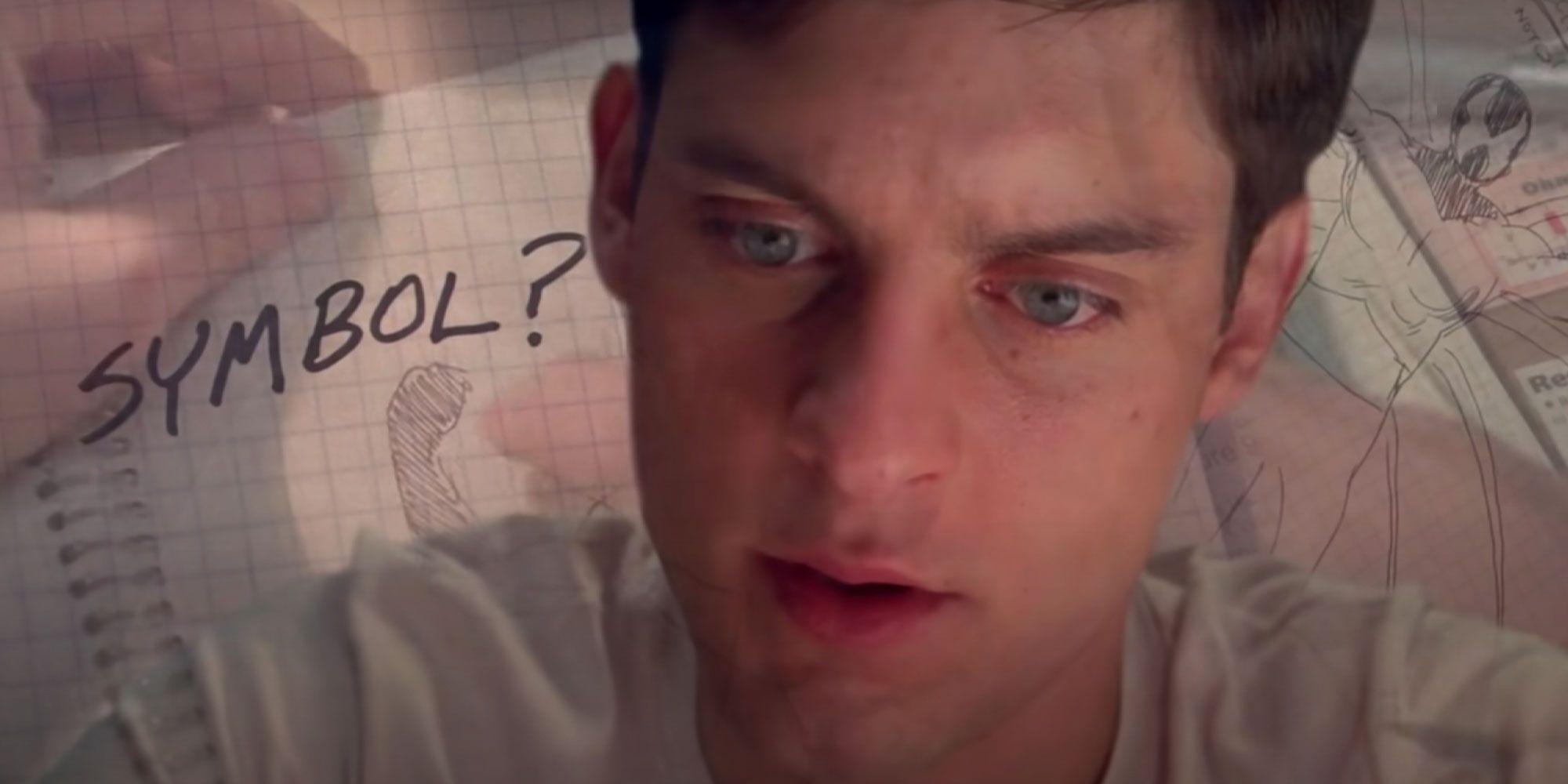 An image of Peter making plans for his suit in Spider-Man