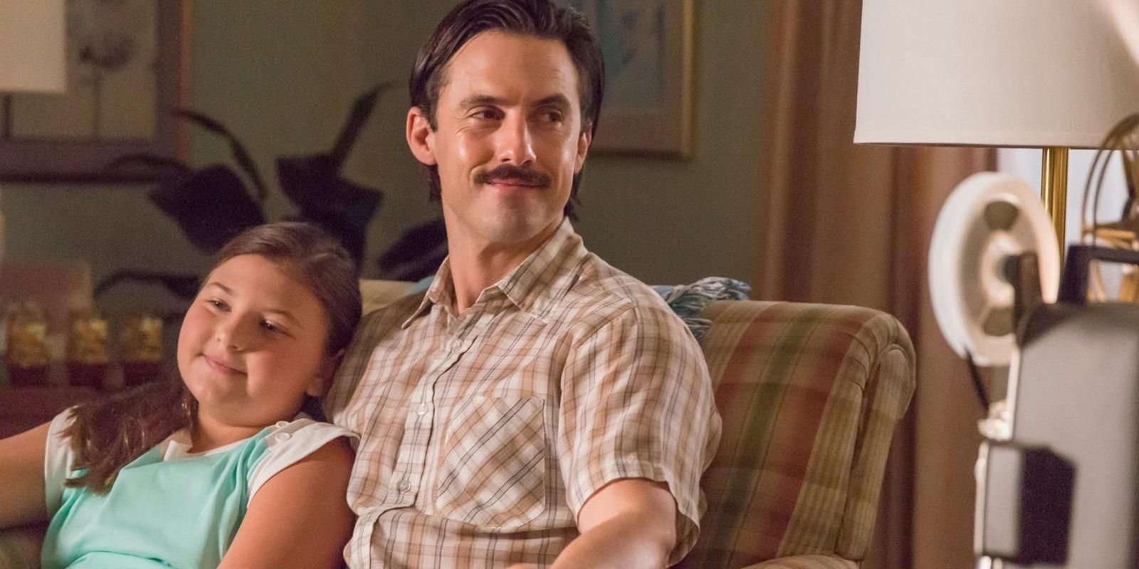 Jack Pearson sits with young Kate Pearson on the couch in This Is Us