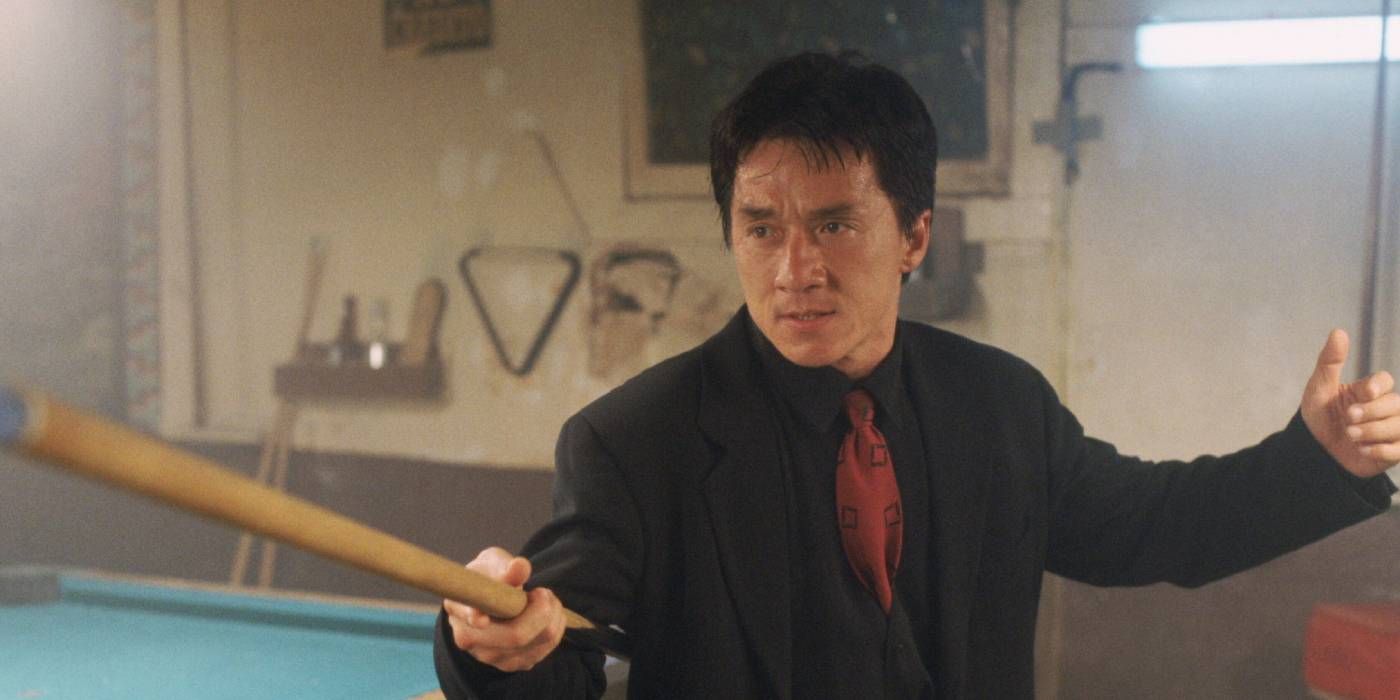 Jackie Chan holding a pool stick in Rush Hour.