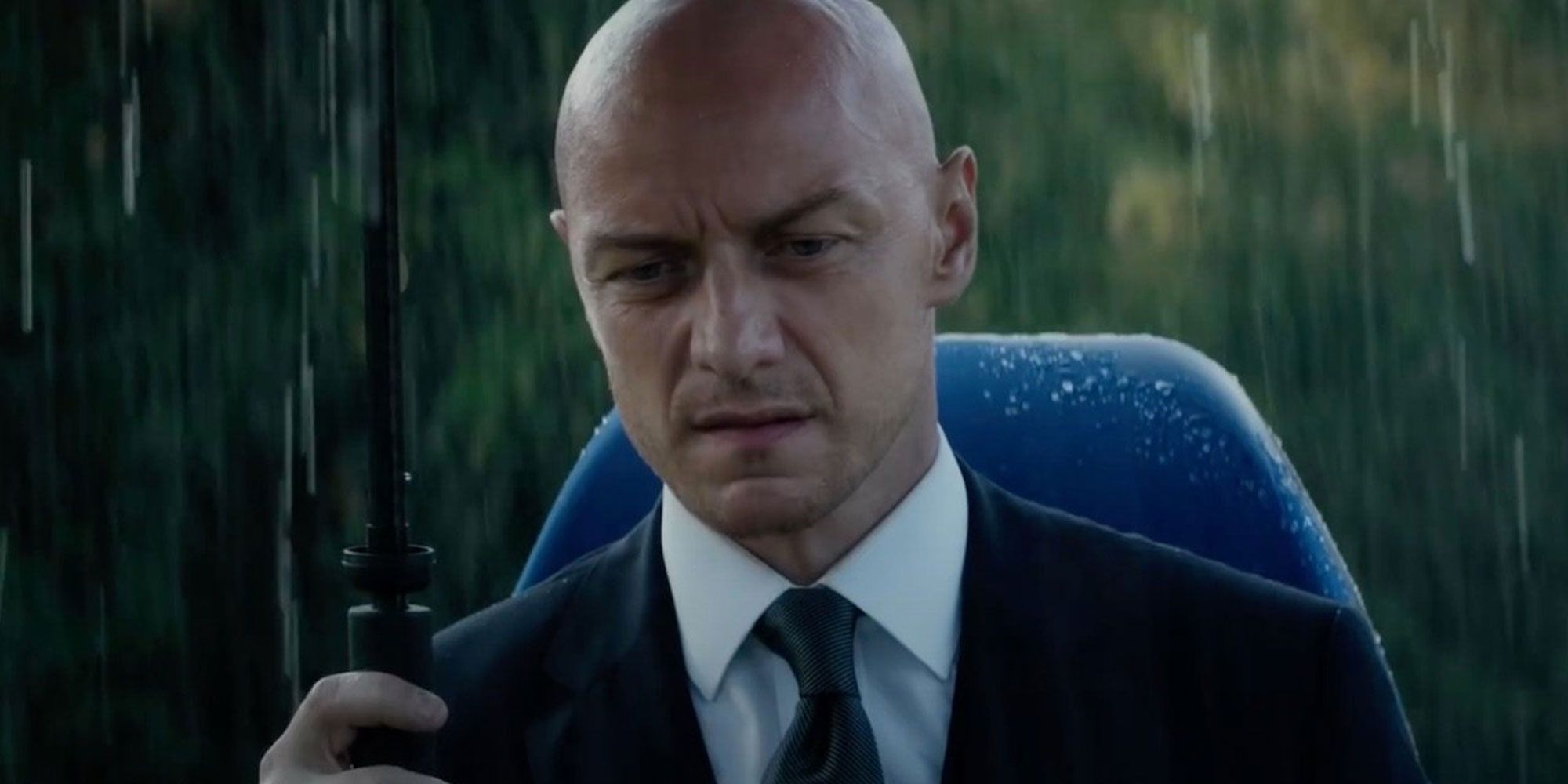 A young Charles Xavier mourns in the rain at a funeral. 