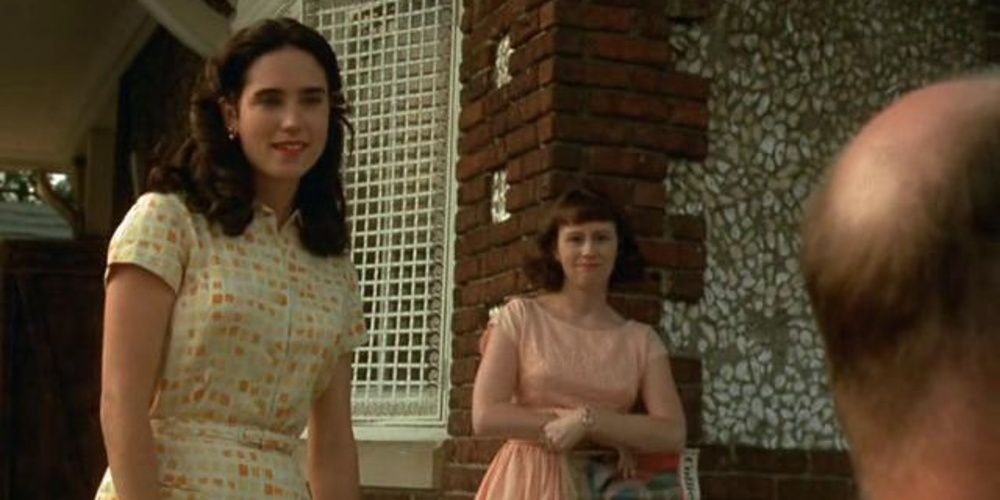 Jennifer COnnelly smiling at Ed Harris in Pollock