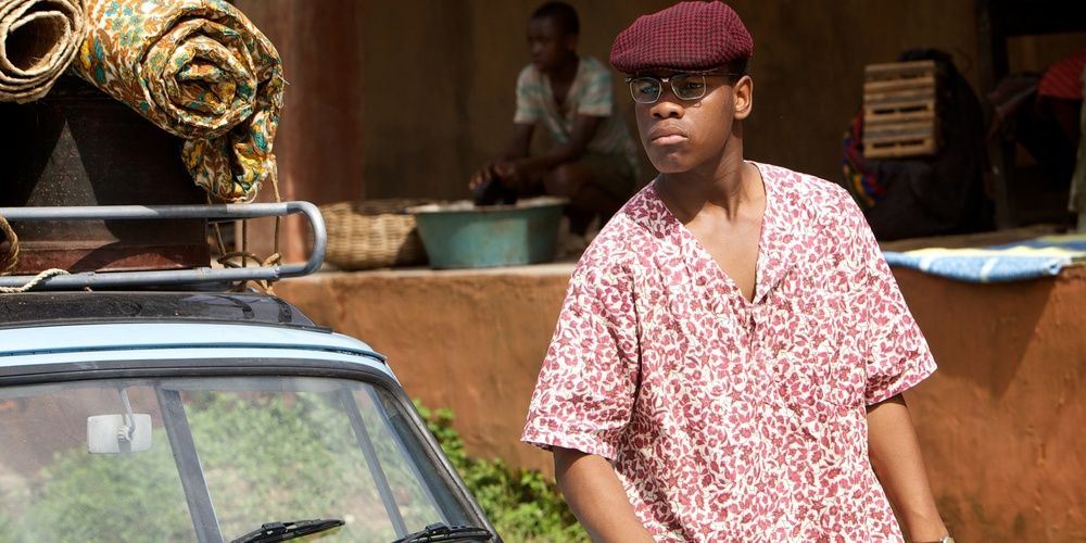 John Boyega steps out of a car in Half of a Yellow Sun 