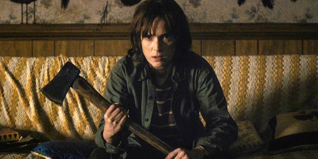 Joyce Byers sitting with a sledgehammer