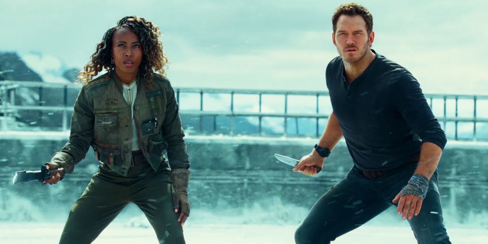 Jurassic World Dominion actors Chris Pratt and DeWanda Wise in battle stance