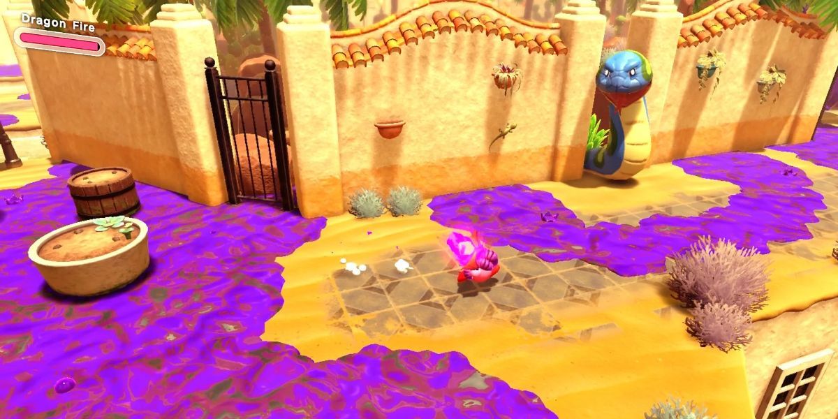 Kirby and a big snake at the Kirby and the Forgotten Land level Searching The Oasis. 