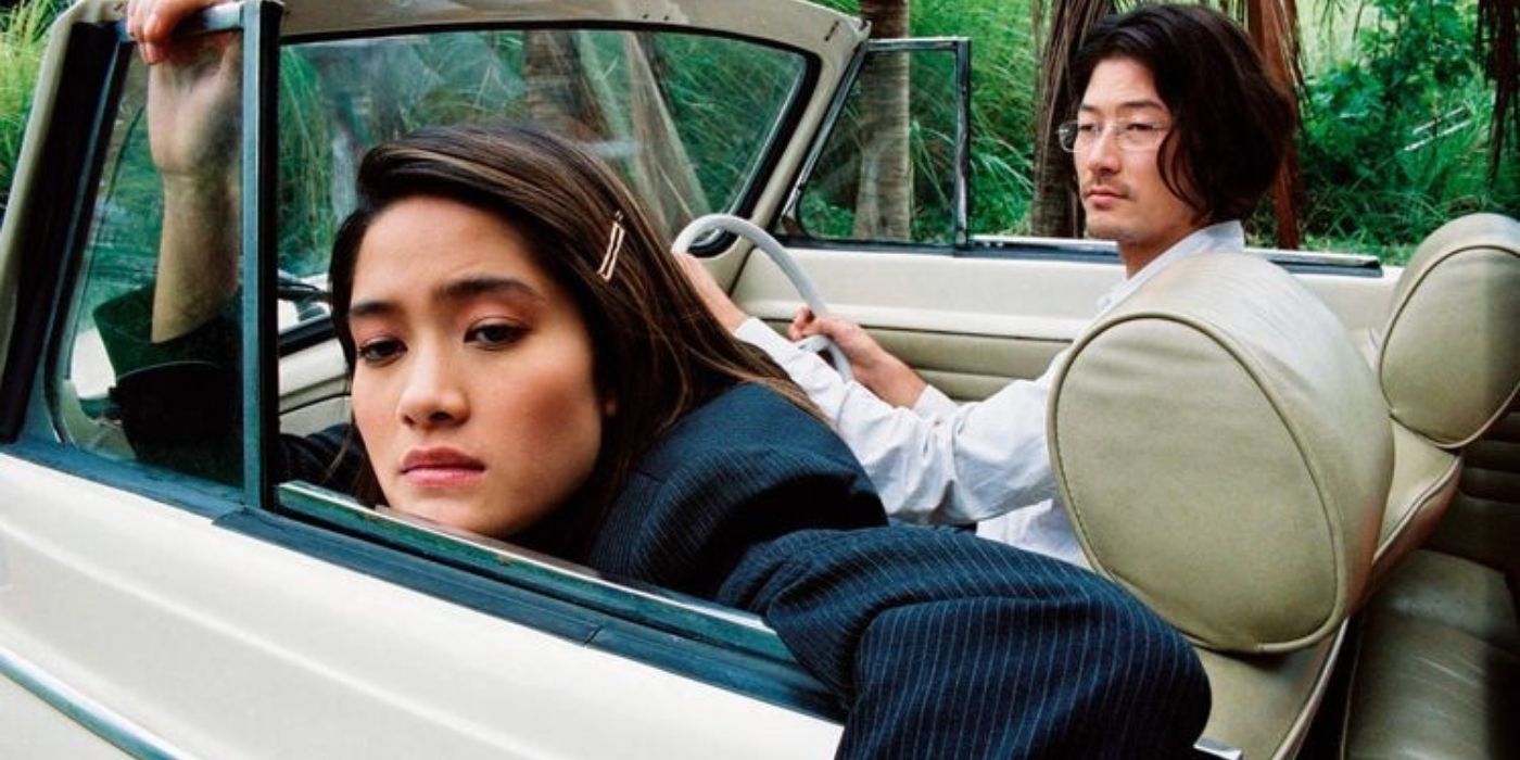 Two characters in a car in the 2003 film Last Life in the Universe.