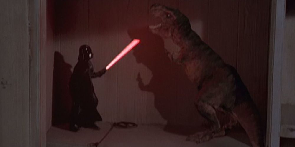 Lightsaber wielding Darth Vader from Star Wars battles Rexy the T rex Tyrannosaurus Rex from Jurassic Park in The Indian in the Cupboard