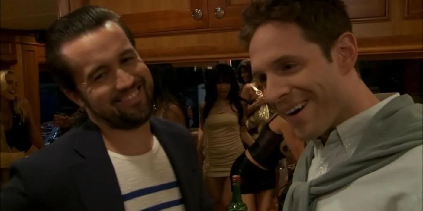 Mac and Dennis smiling on a boat in Its Always Sunny