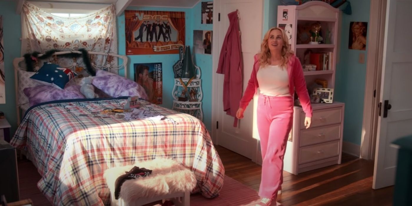 Stephanie walking in her bedroom in a matching track suit Senior Year