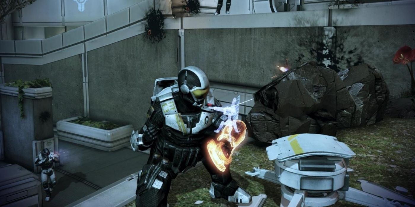 A Cerberus engineer setting up a weapon in Mass Effect 3.