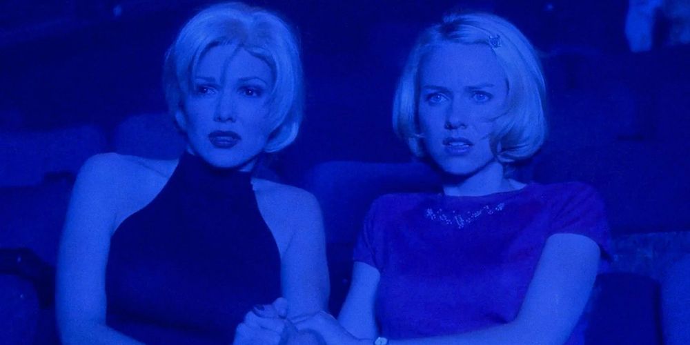 Betty and Rita sit in blue light in Mulholland Drive