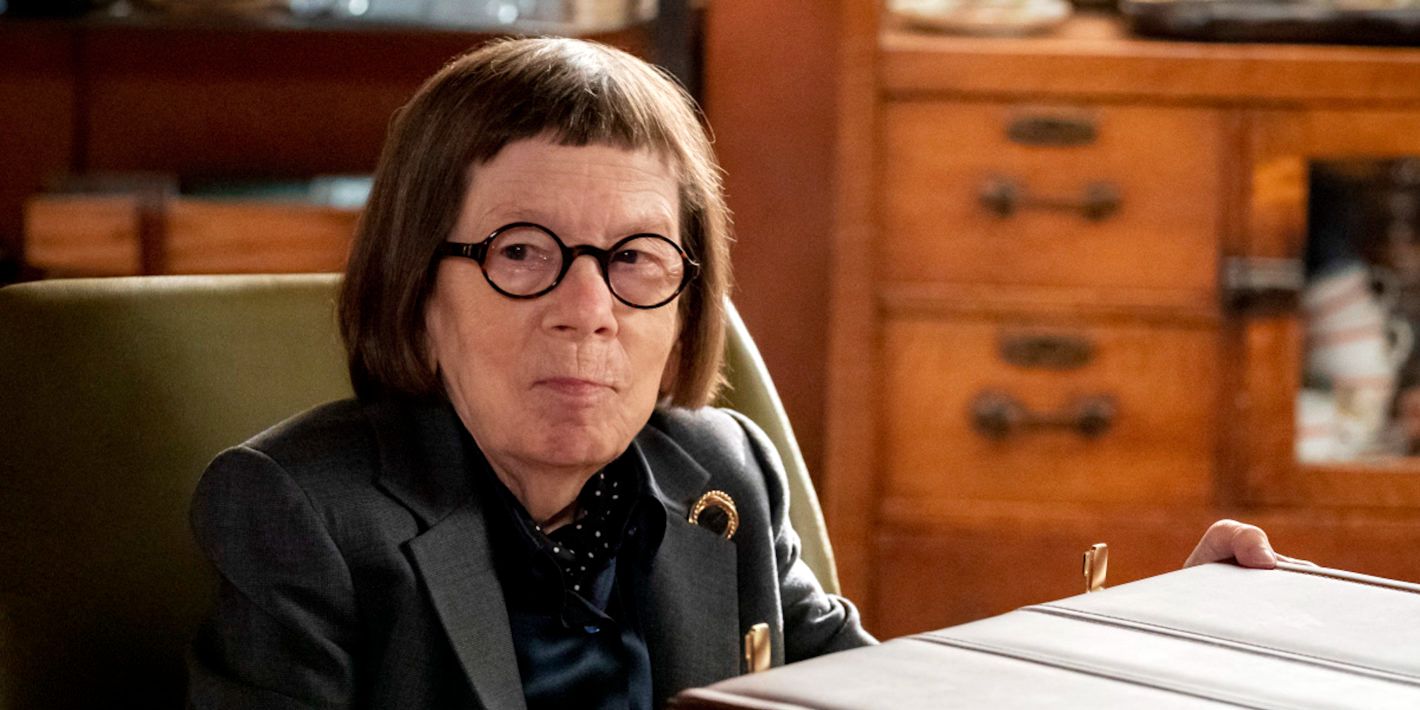 Linda Hunt as Hetty Lange sitting at a desk in NCIS Los Angeles