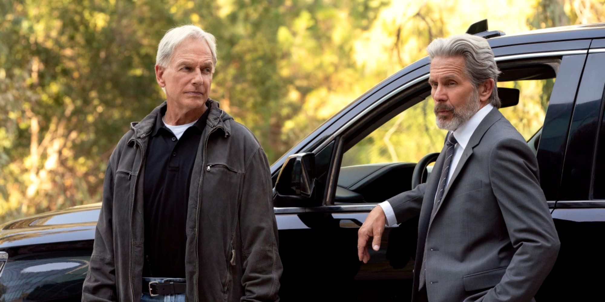 Leory Gibbs and Alden Parker stand in front of a black SUV in NCIS season 19