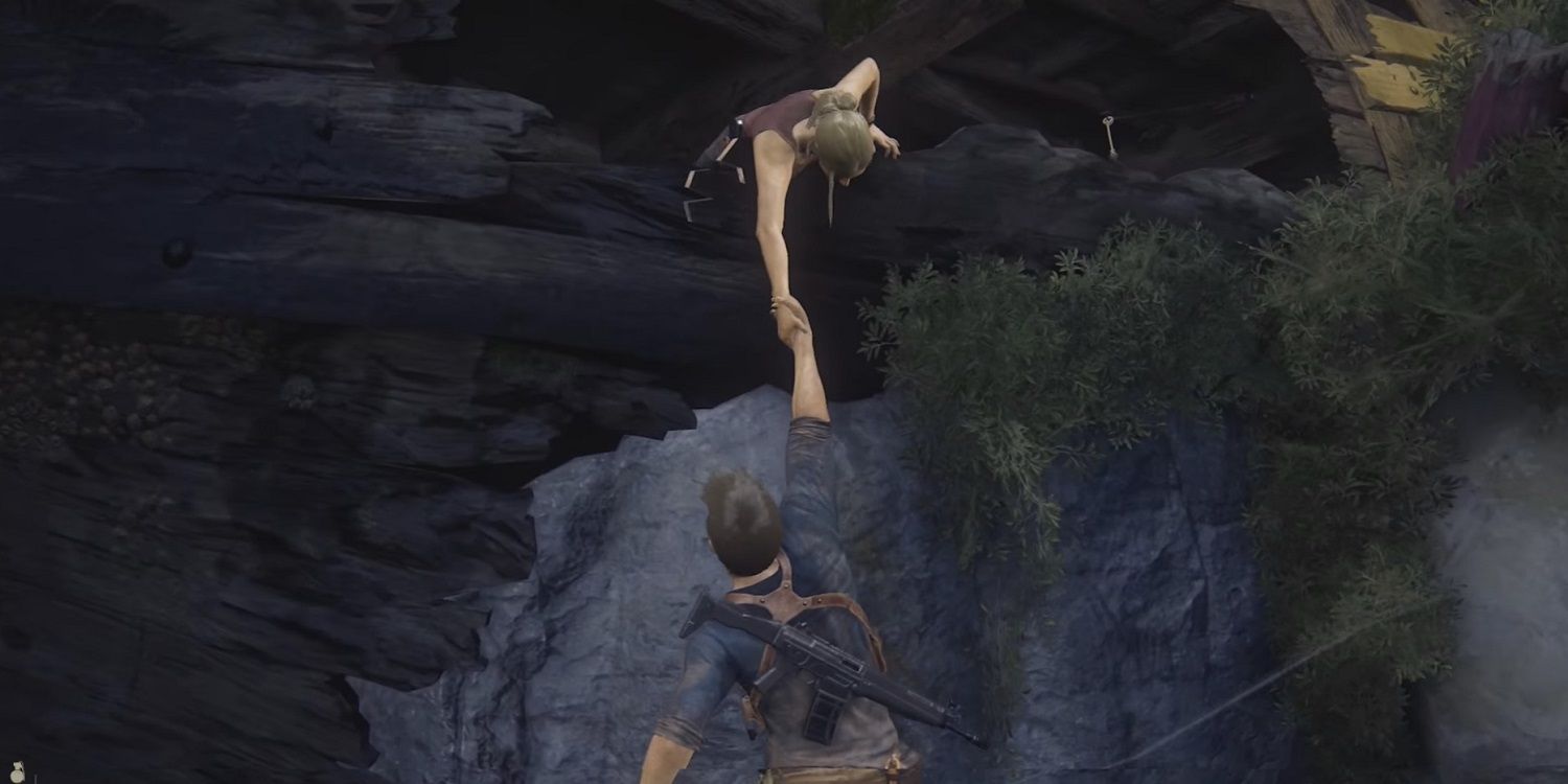 Nate holds on to Elenas hand in Uncharted 4 A Theifs End Cropped 1