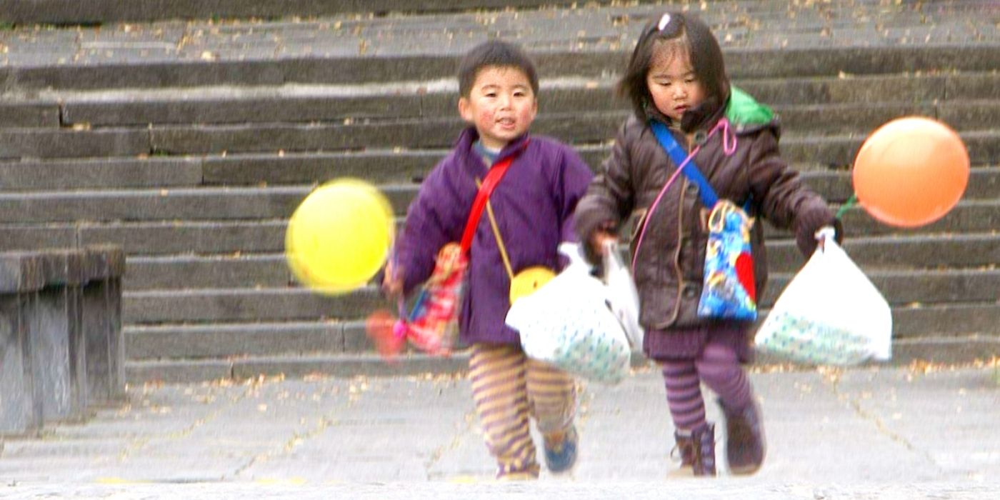 Two children holding grocery bags and walking together on Old Enough!