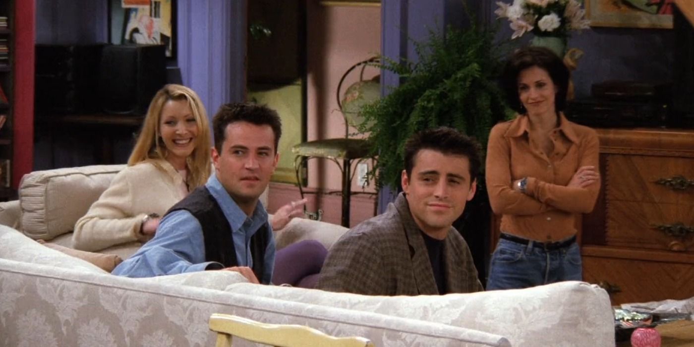 Phoebe, Chandler, and Joey sitting on the couch at Monica's living room in Friends