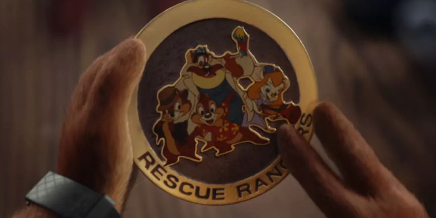 Dale holds the golden Rescue Rangers Pog
