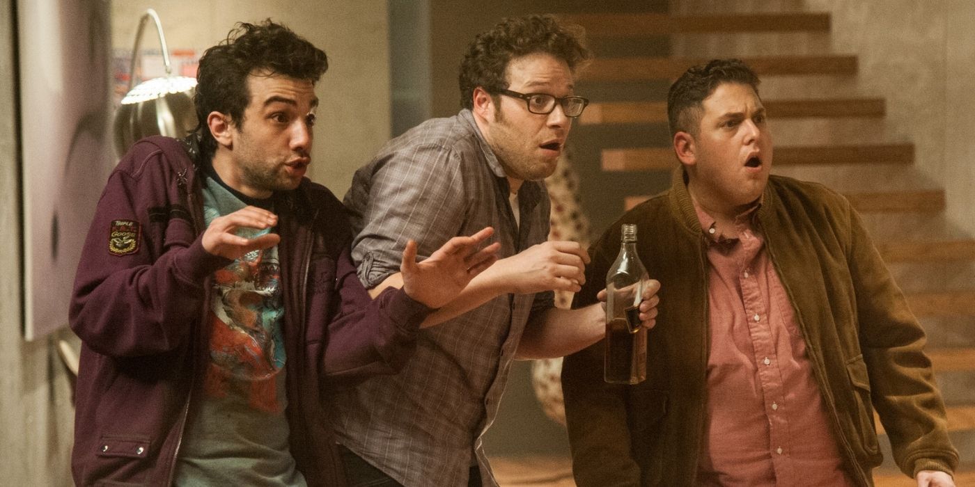 Rogen holding a beer and looking scared in This Is The End