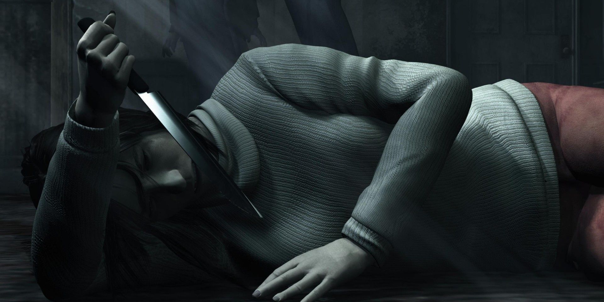 Angela lying on the floor and holding a knife in Silent Hill 2